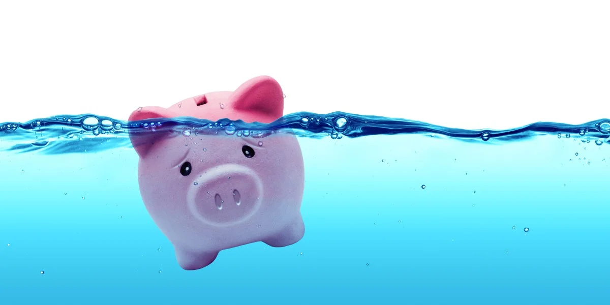 Piggy bank drowning in debt concept 83790065